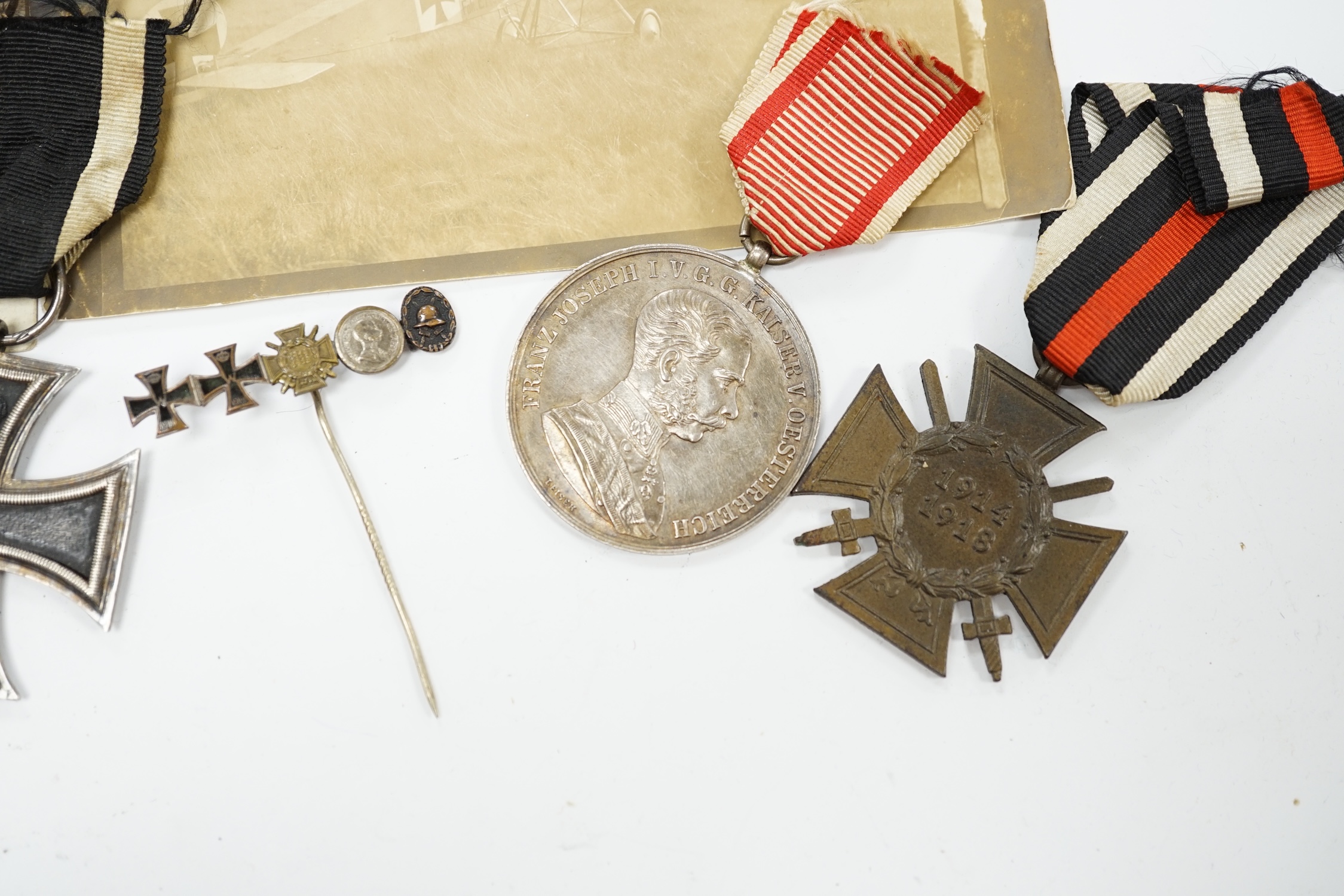 Four First World War German medals; a First Class Iron Cross, a 2nd Class Iron Cross, a 1914-1918 Honour Cross and an Austro-Hungarian Medal for Bravery, together with a wound badge and the related stick pin for the meda